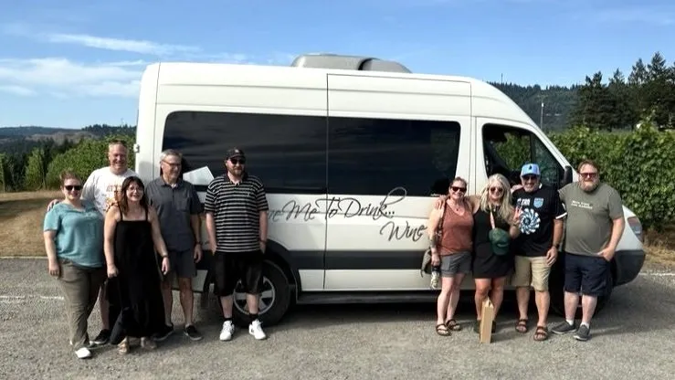 Group of 8 guests with their private driver during a Willamette Valley wine tour in Oregon wine country.