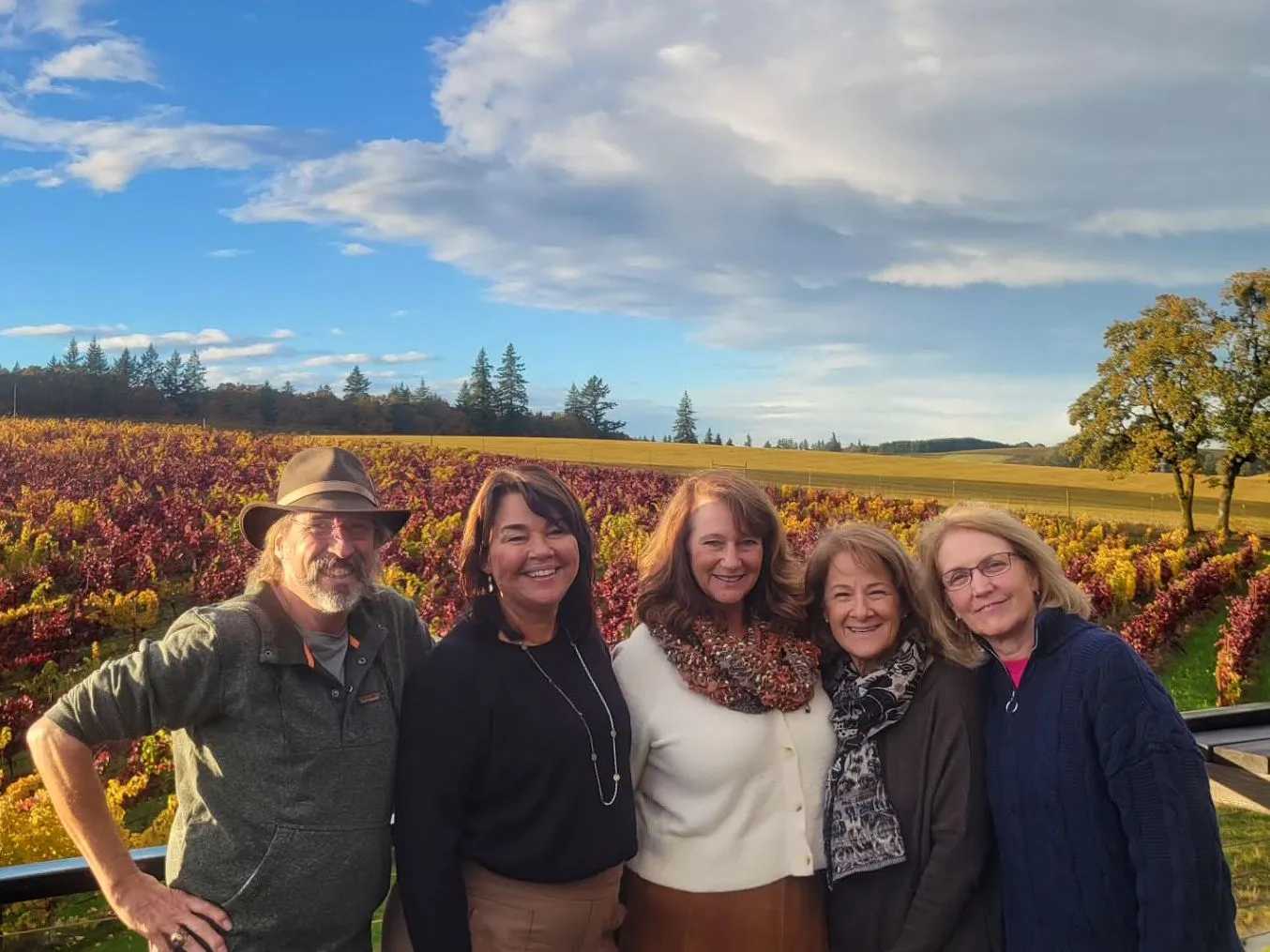 Group of 5 enjoying a relaxed wine tour at a vineyard near Carlton in Oregon&rsquo;s Willamette Valley